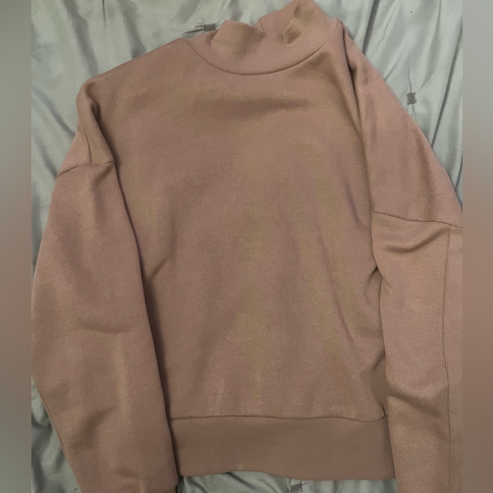 pink turtleneck sweater